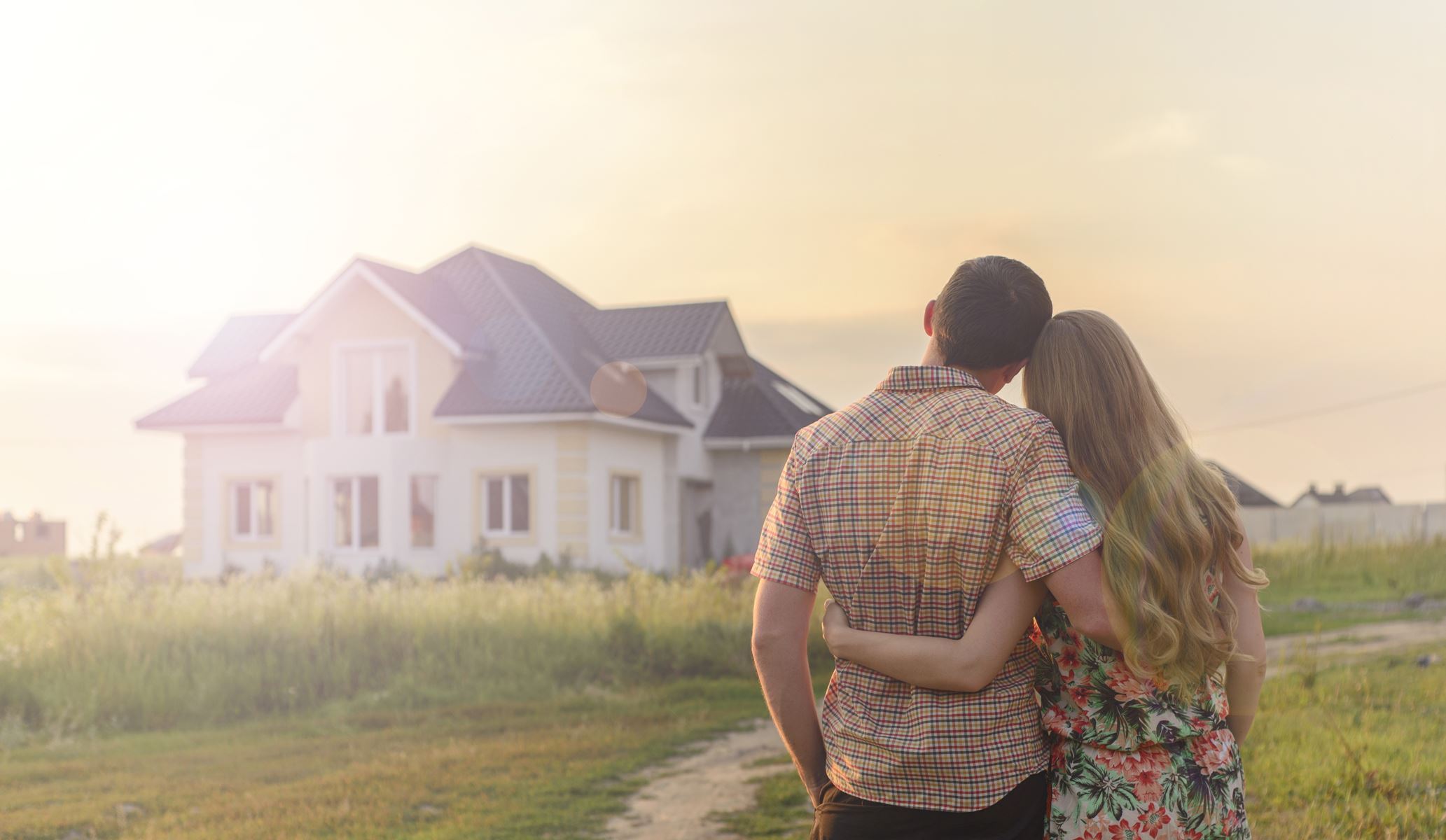 couple infront of house